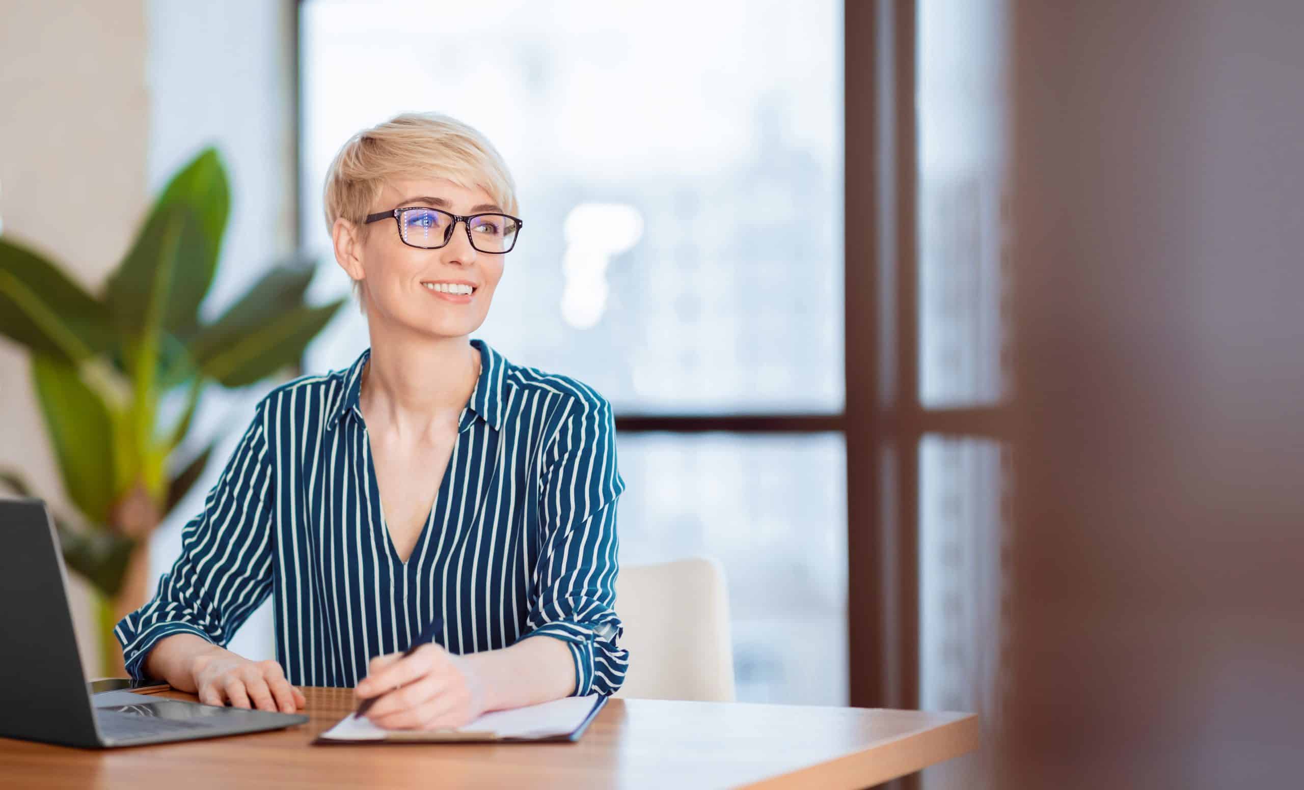 Business Lady Taking Notes Looking Aside Sitting In Modern Office Why Medical Admin Can't Be Fully Automated (And What Actually Works Instead)